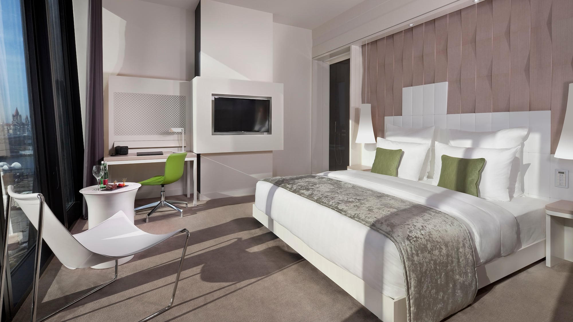 a room with a bed and a television