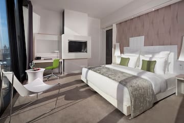 a room with a bed and a television
