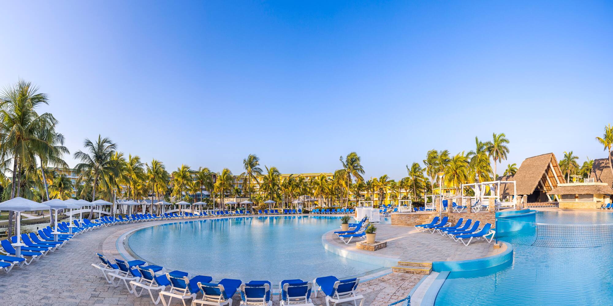 a pool with chairs around it