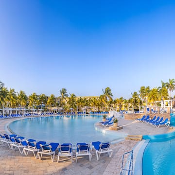 a pool with chairs around it