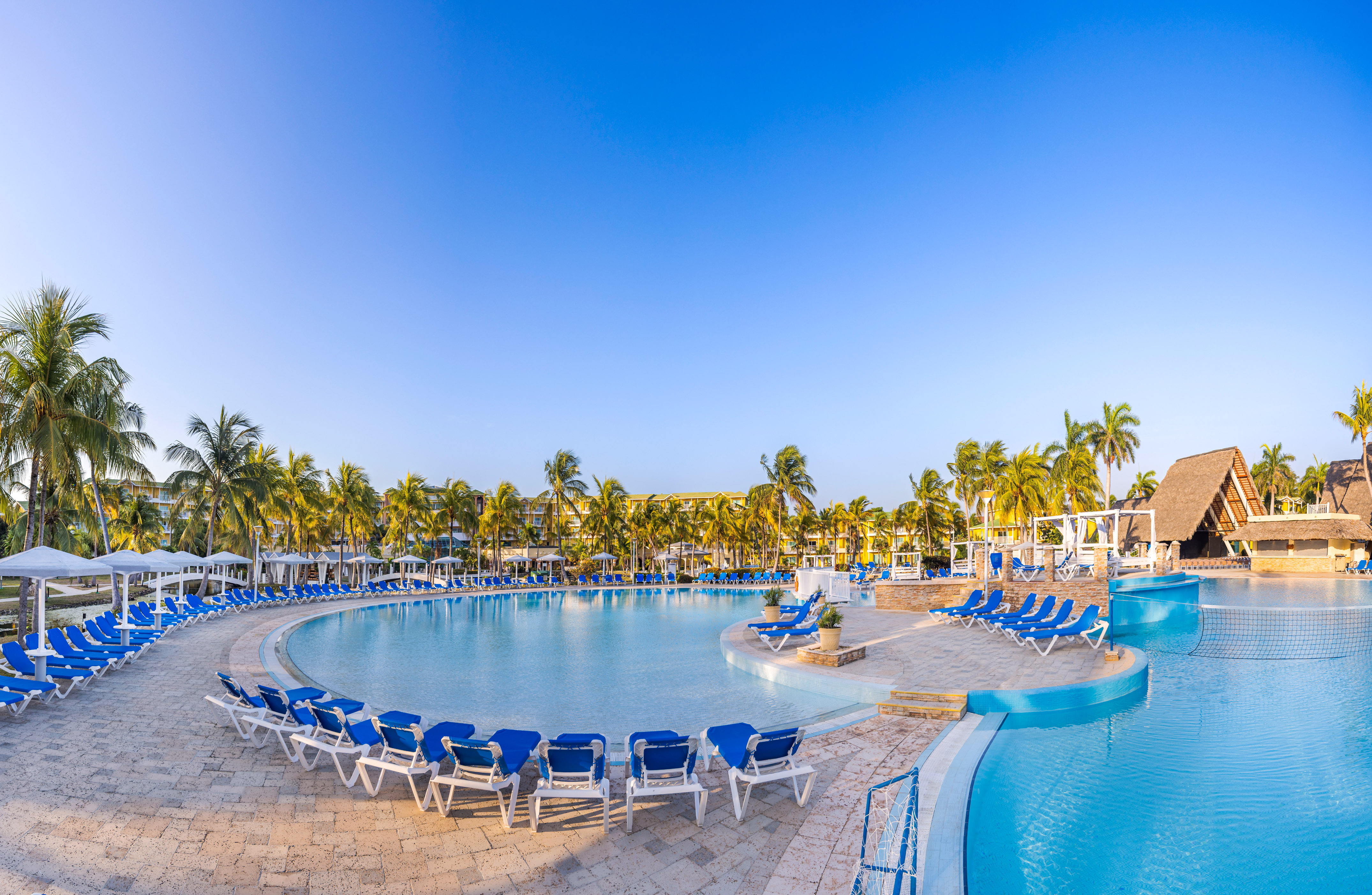 a pool with chairs around it