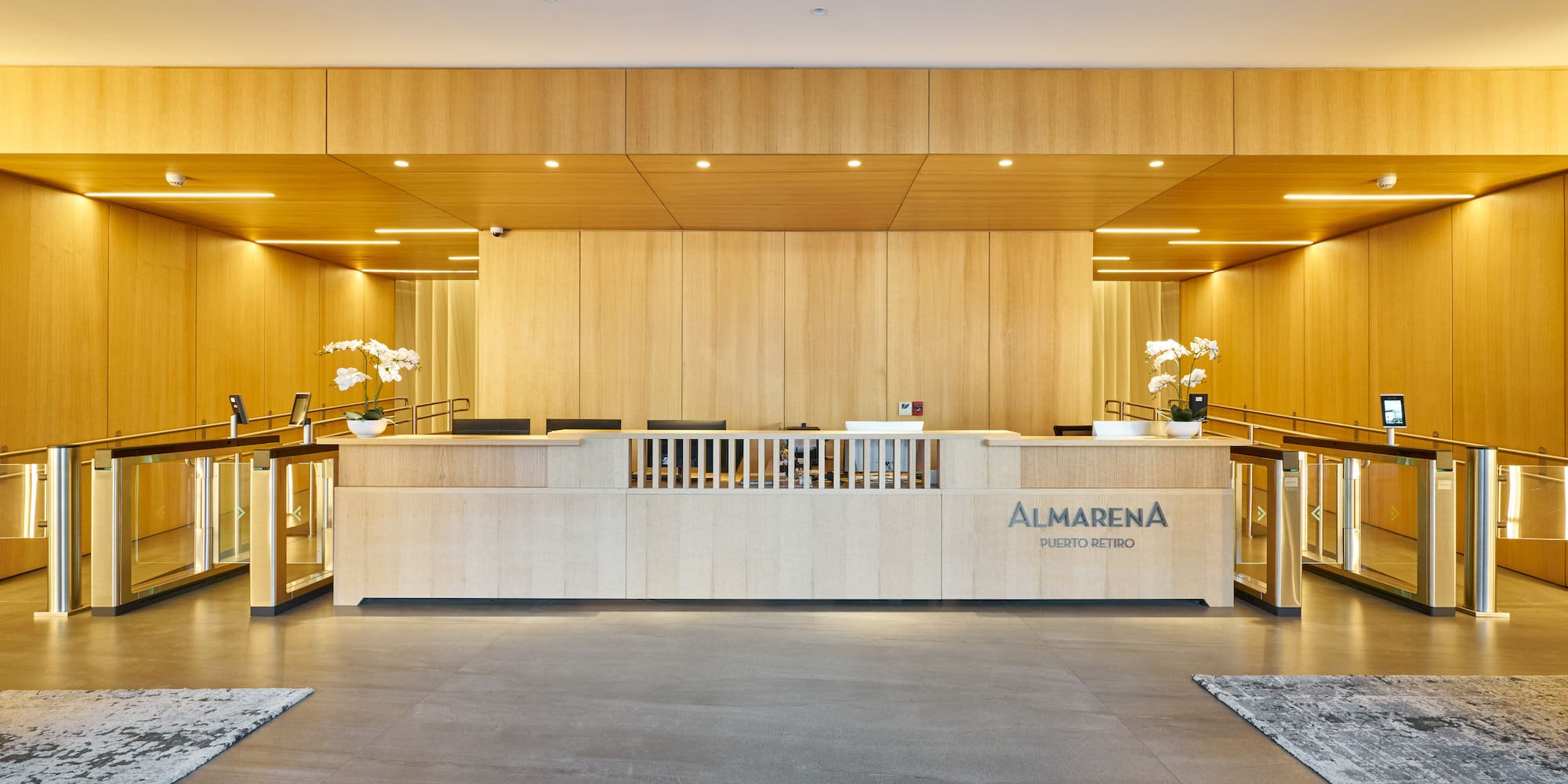 a lobby with a counter and a rug