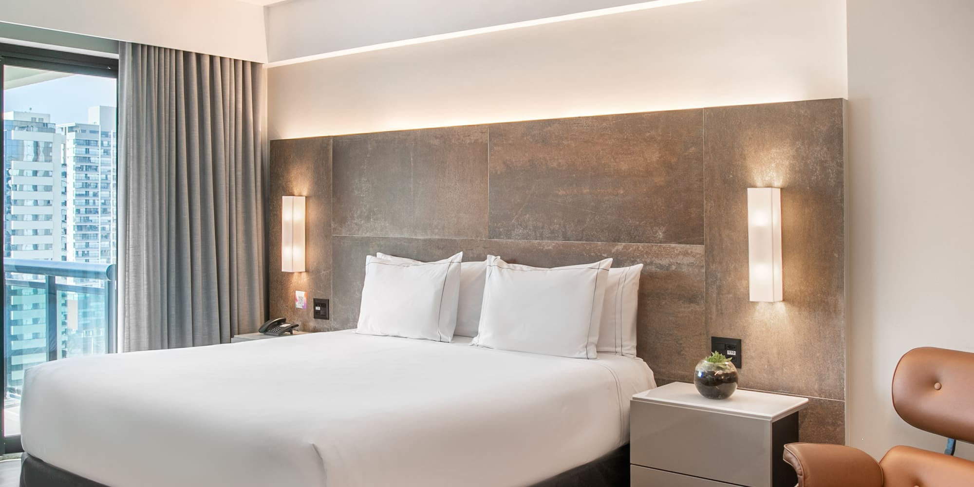 a room with a bed and a chair