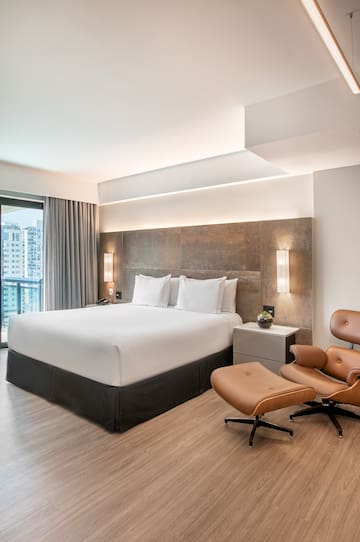 a room with a bed and a chair