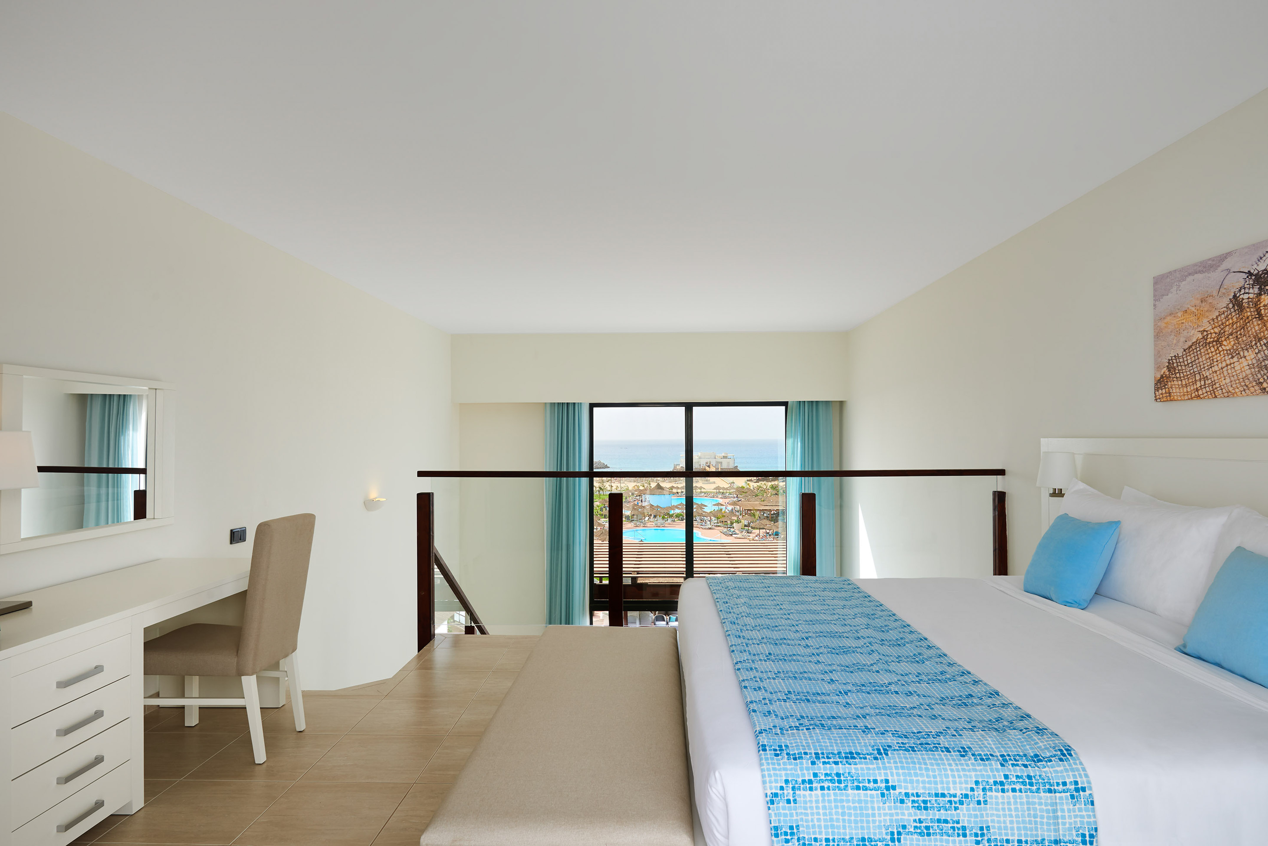 a bedroom with a bed and a table