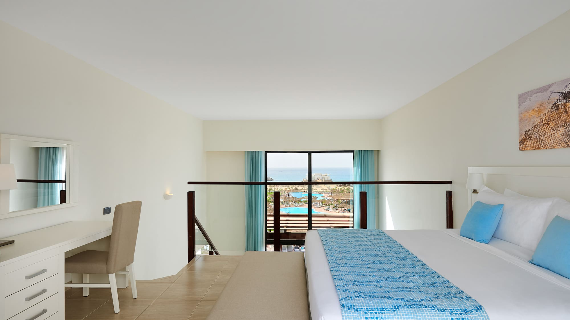 a bedroom with a bed and a table