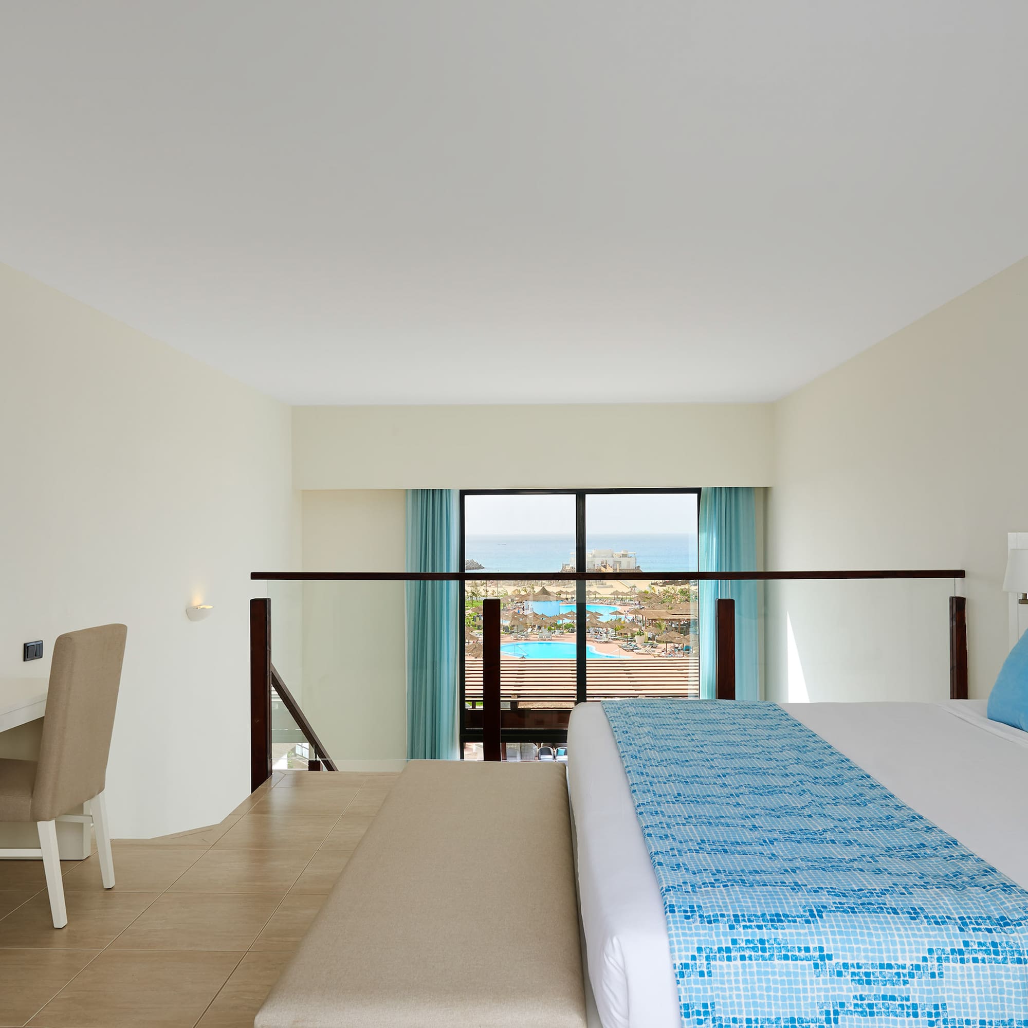 a bedroom with a bed and a table