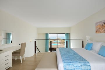 a bedroom with a bed and a table