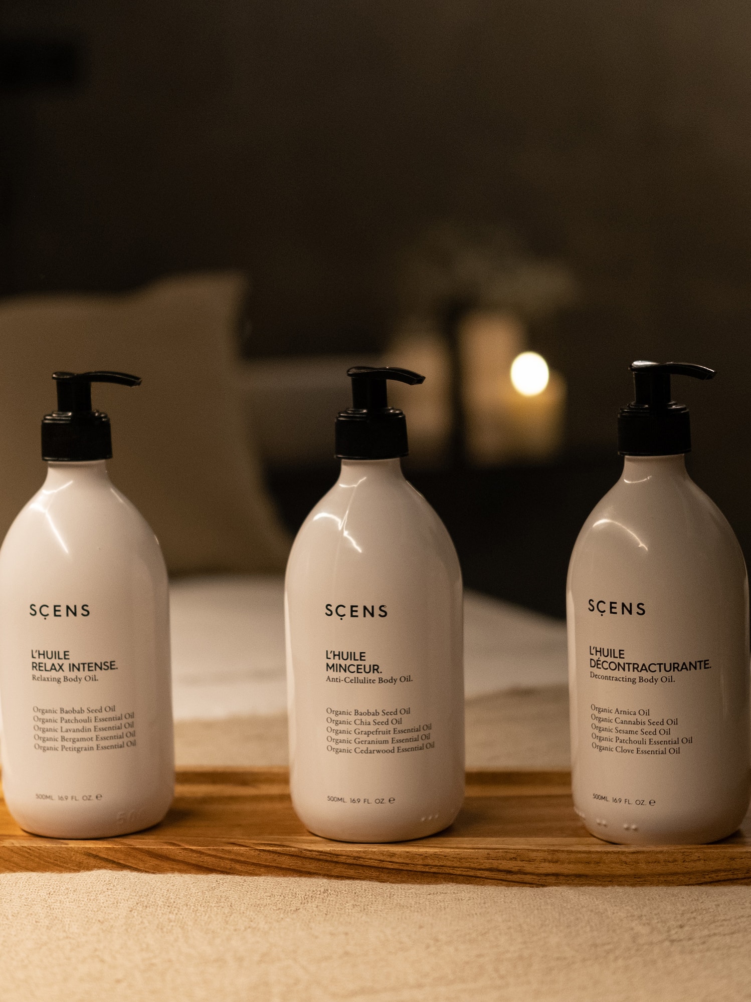 a group of white bottles on a wooden tray