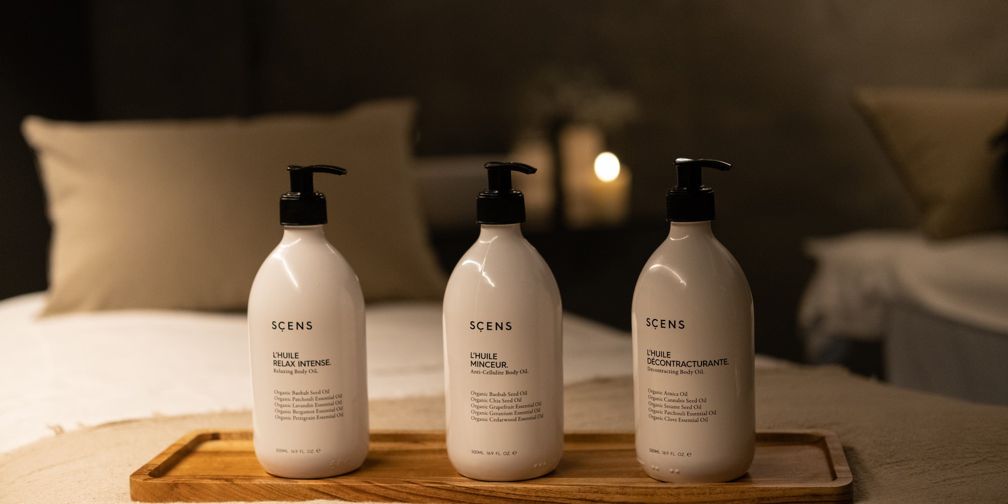 a group of white bottles on a wooden tray