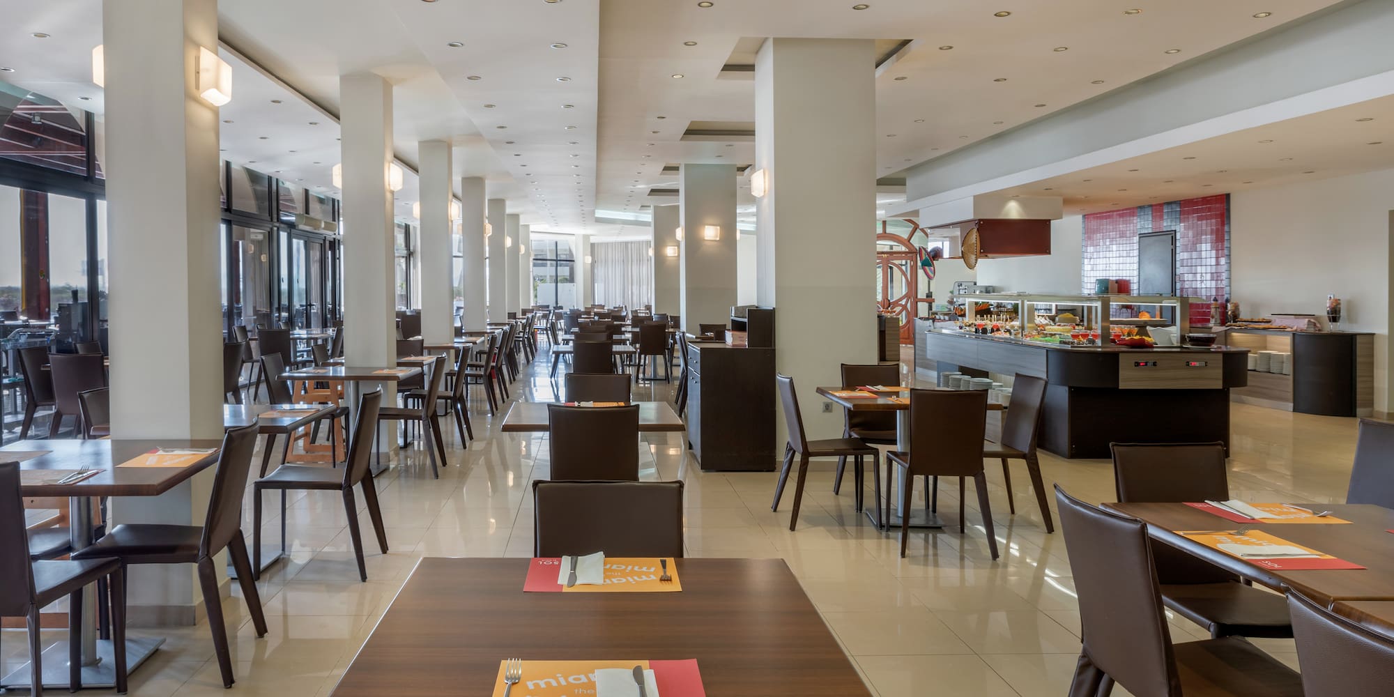 a restaurant with tables and chairs