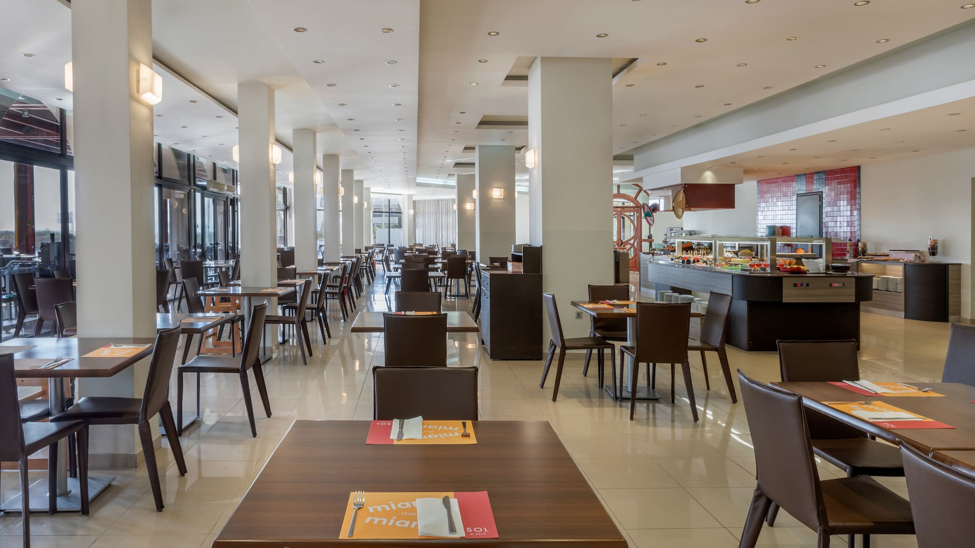 a restaurant with tables and chairs