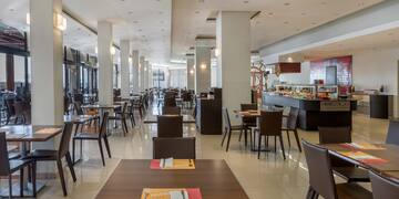 a restaurant with tables and chairs