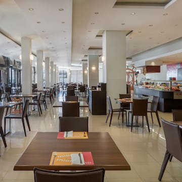 a restaurant with tables and chairs