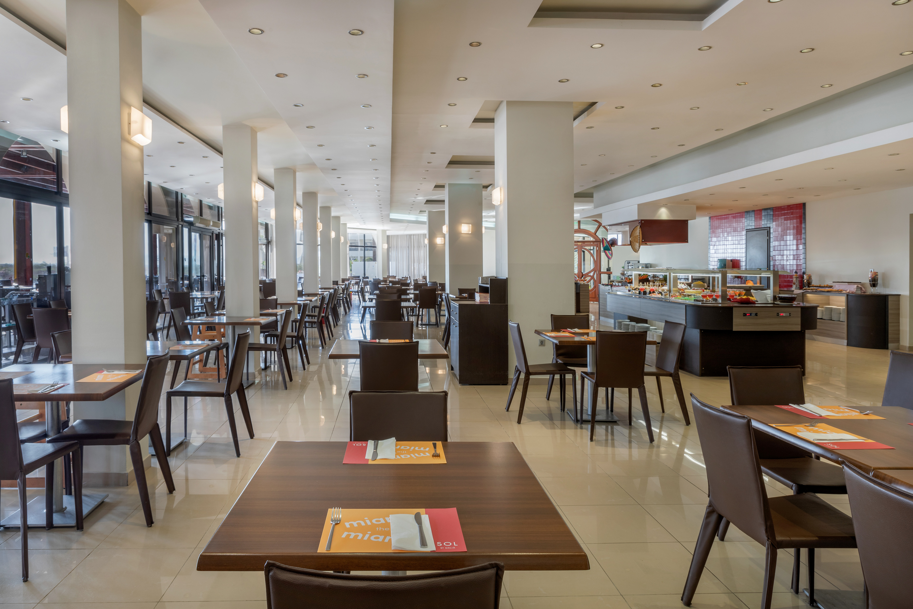 a restaurant with tables and chairs