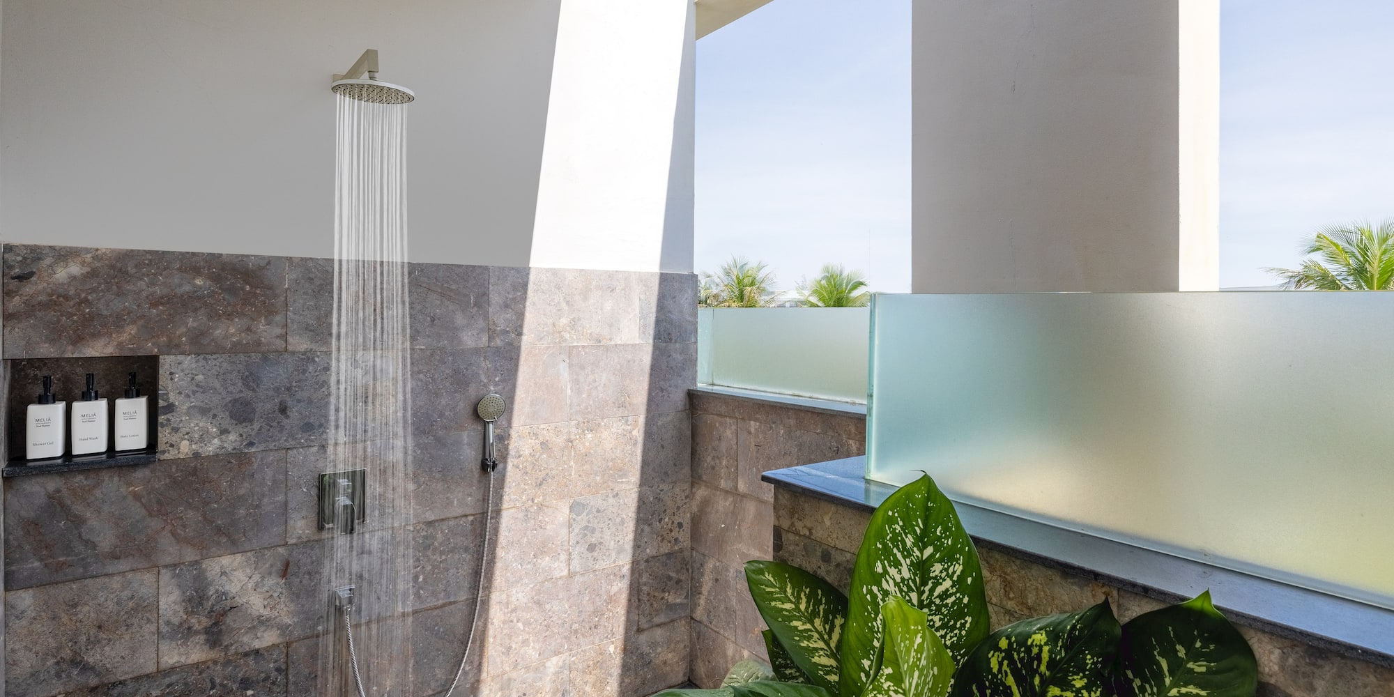 a shower with water running out of it