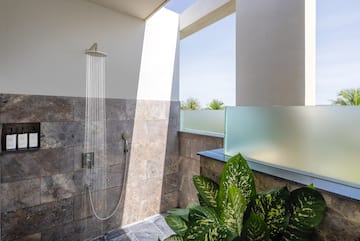 a shower with water running out of it