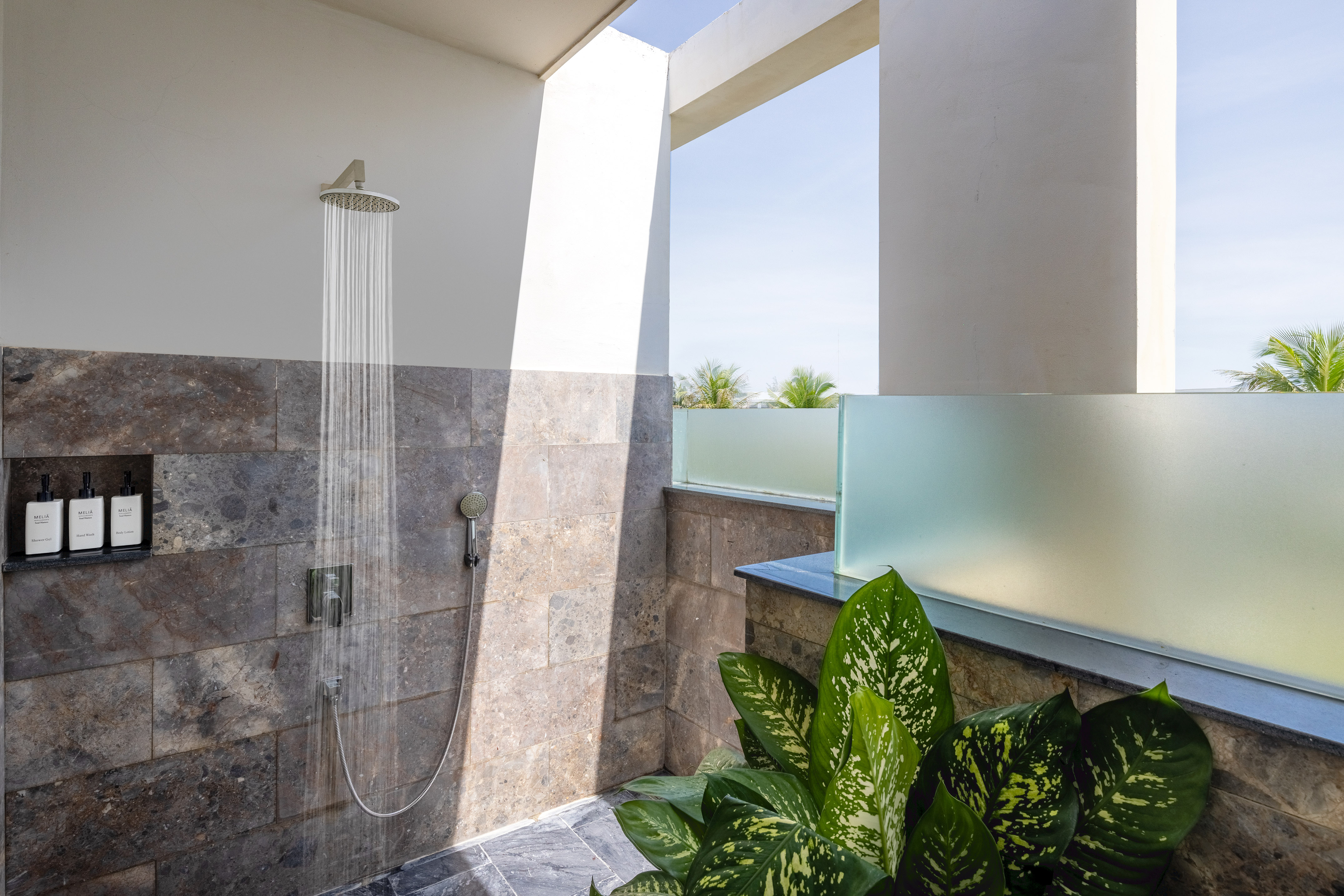 a shower with water running out of it