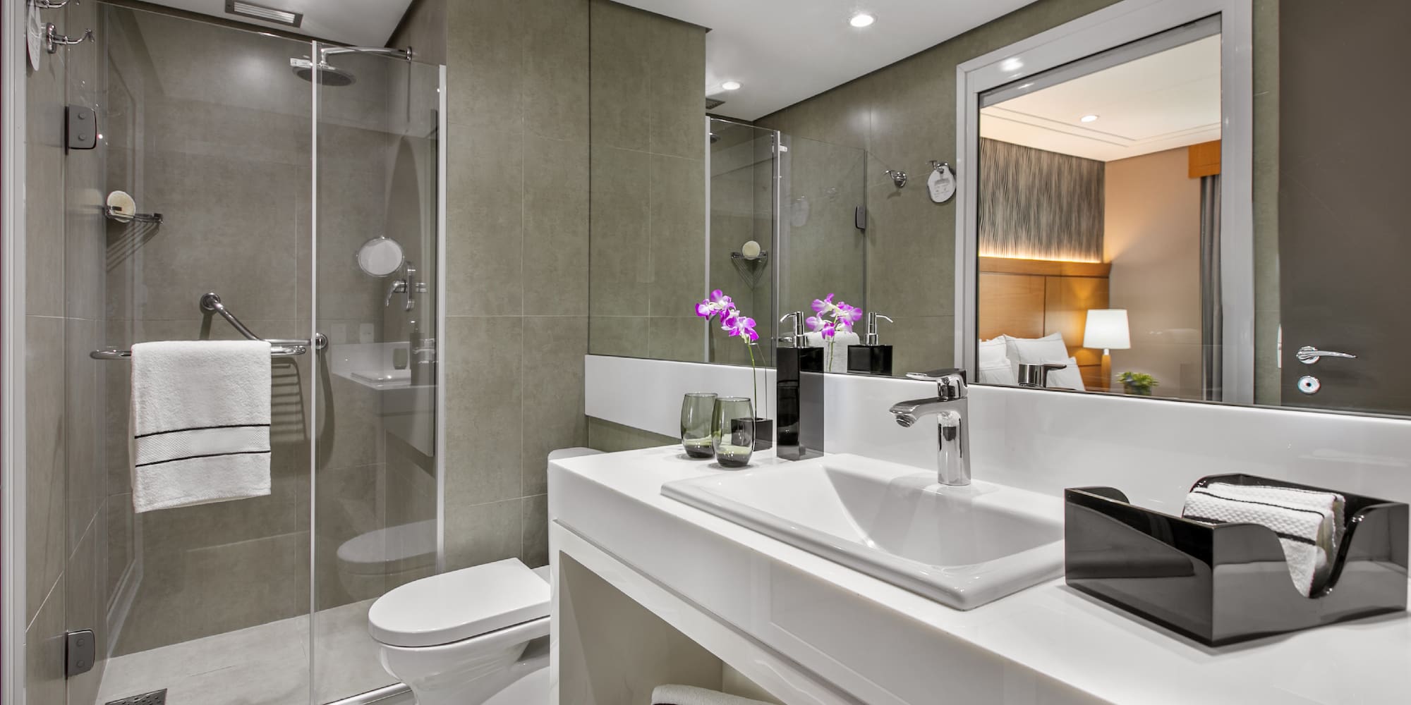 a bathroom with a shower and sink