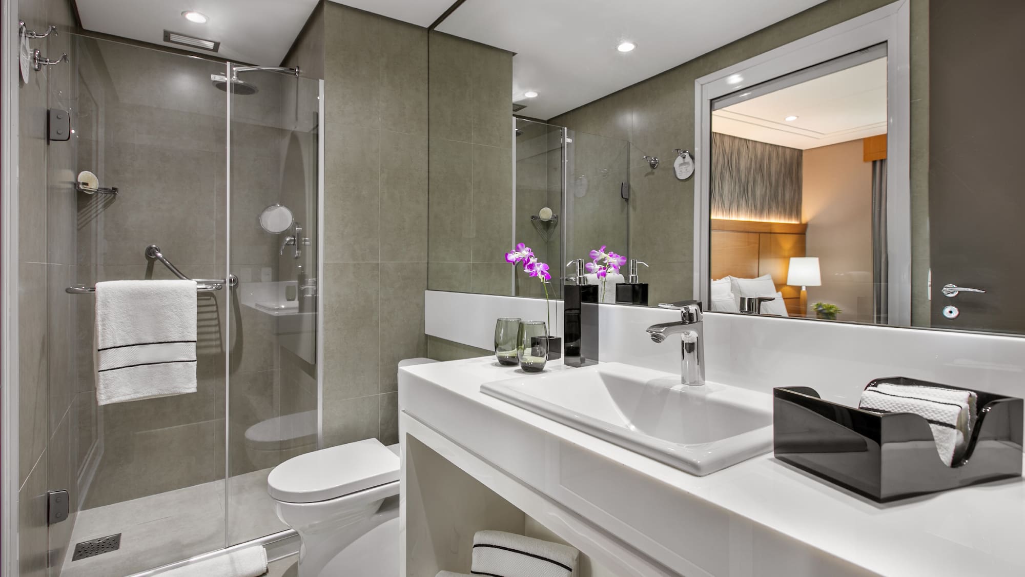 a bathroom with a shower and sink