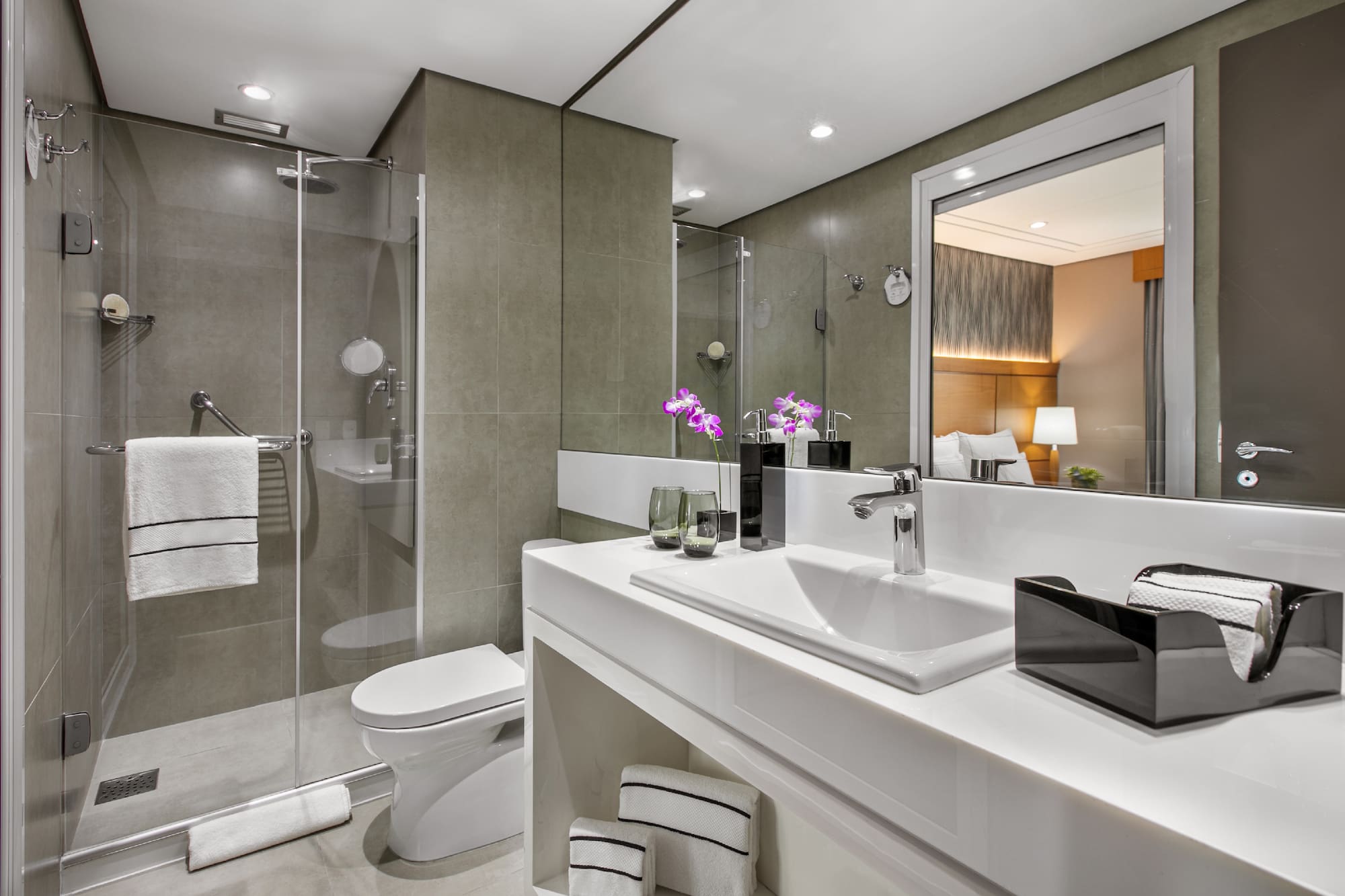 a bathroom with a shower and sink