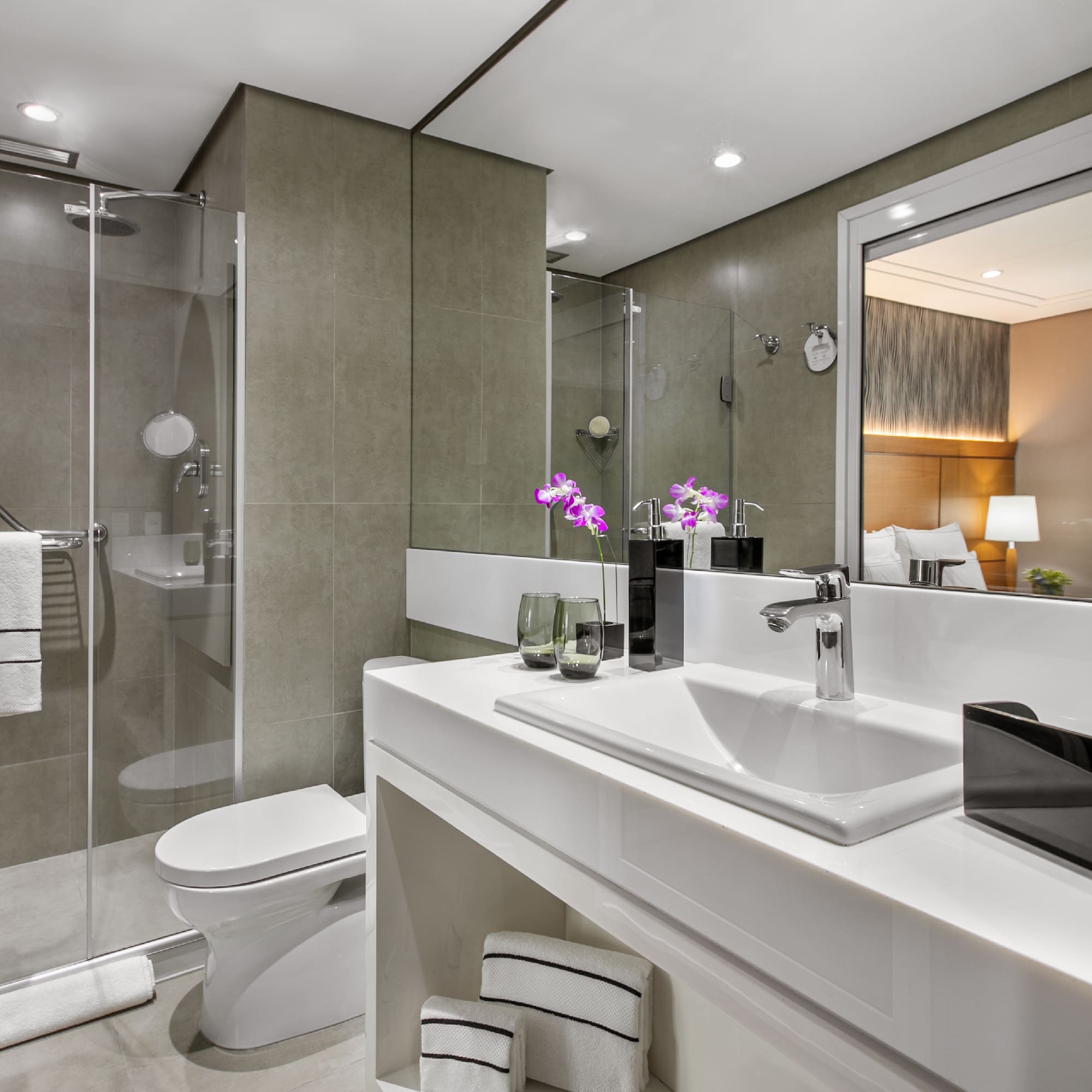 a bathroom with a shower and sink