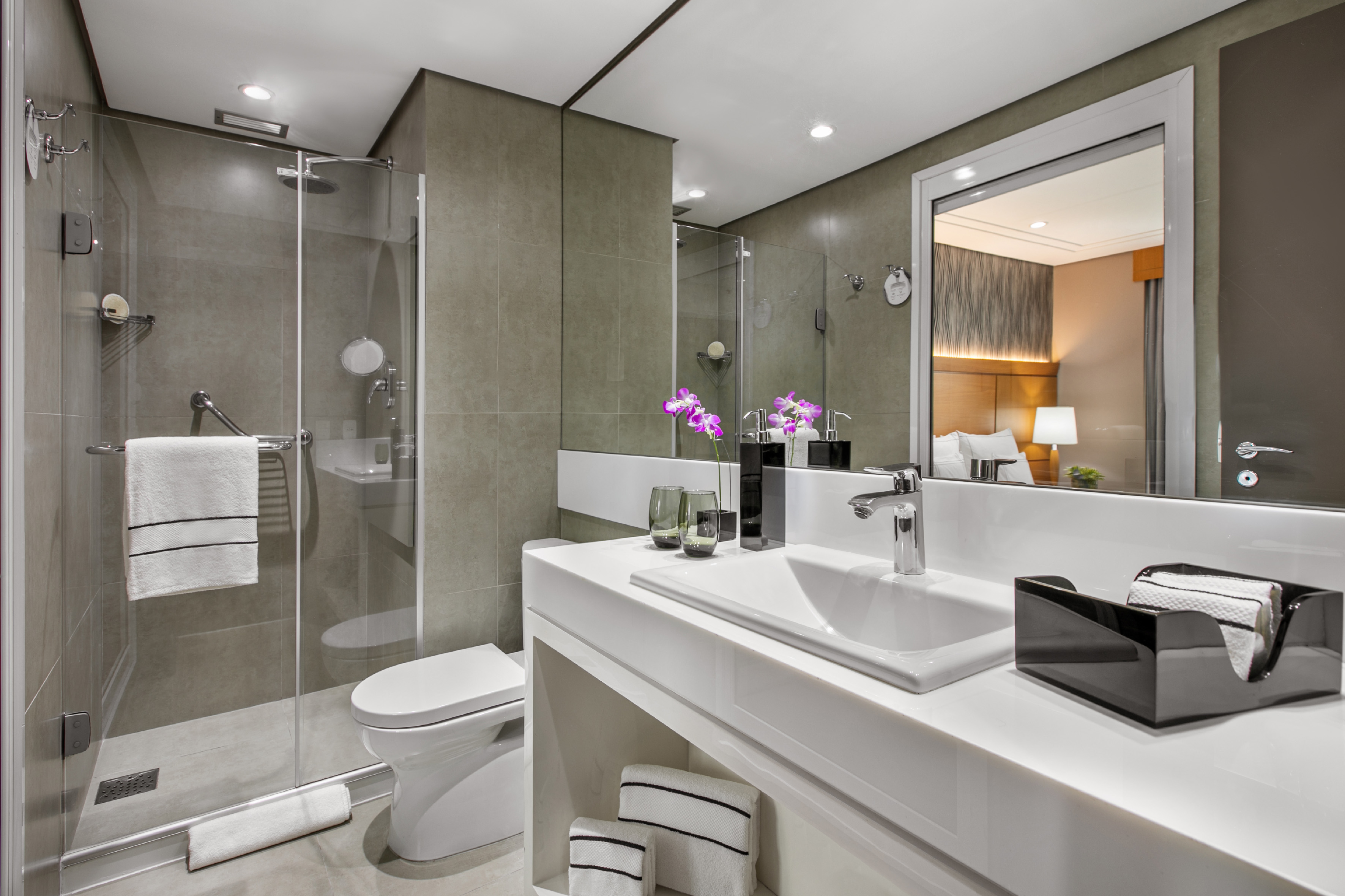 a bathroom with a shower and sink