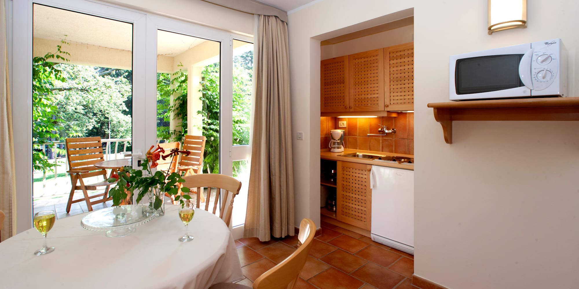 a kitchen with a table and chairs