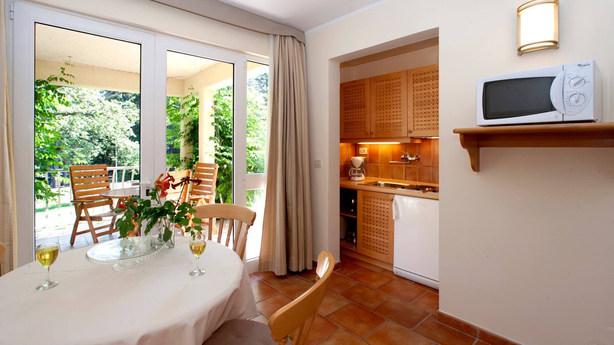 a kitchen with a table and chairs