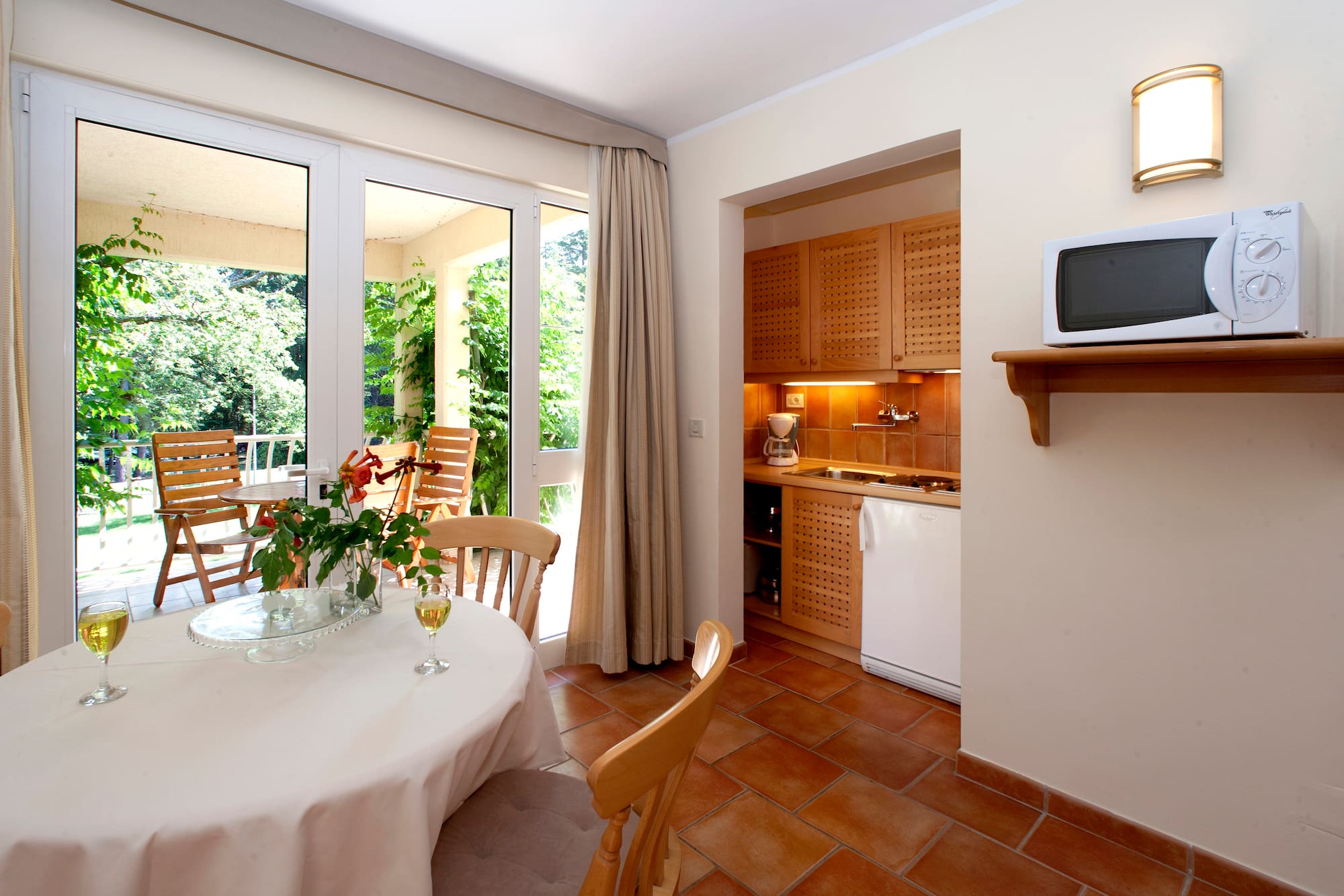a kitchen with a table and chairs
