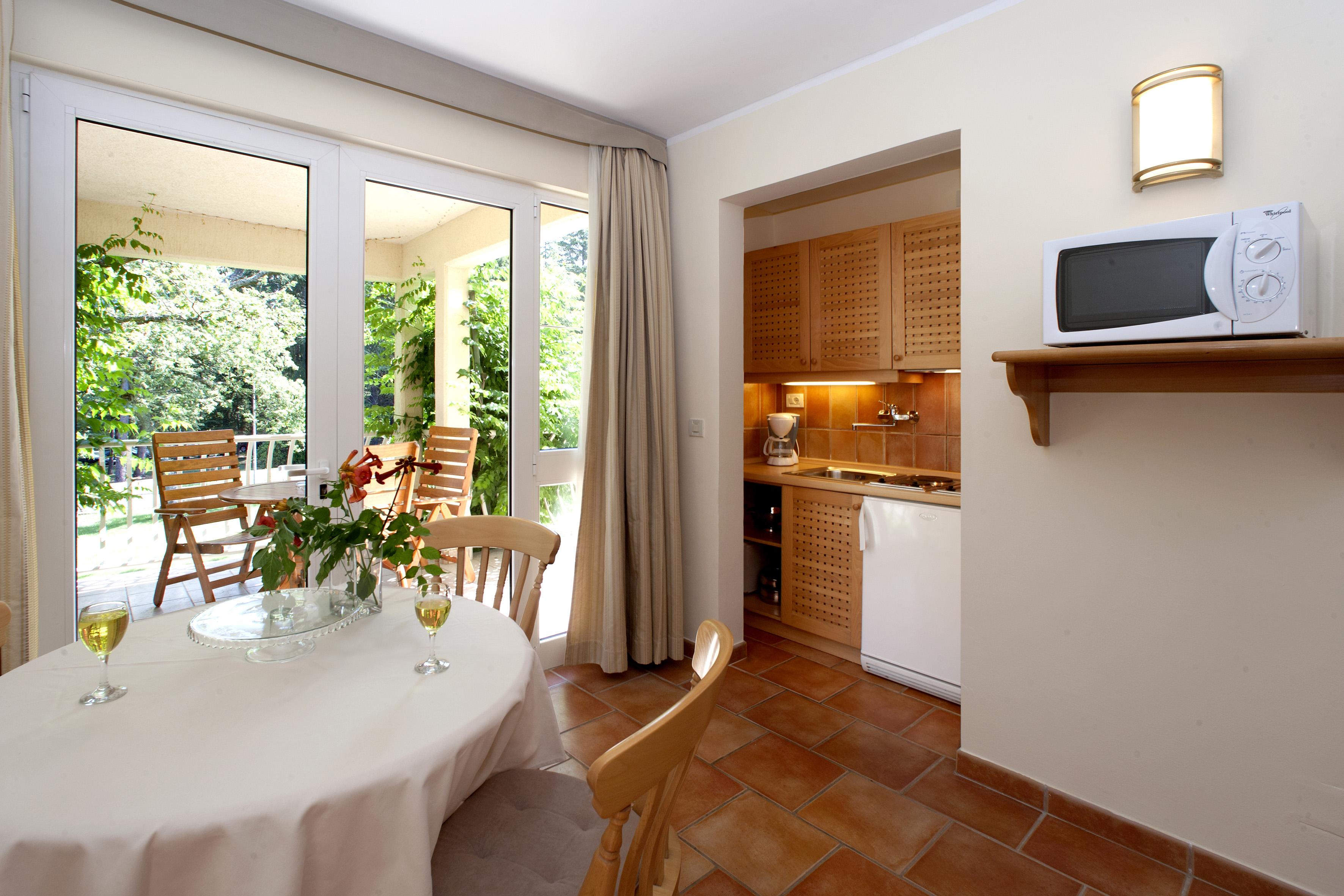 a kitchen with a table and chairs