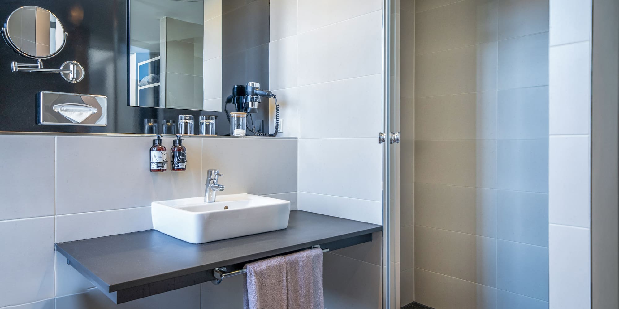 a bathroom with a sink and shower