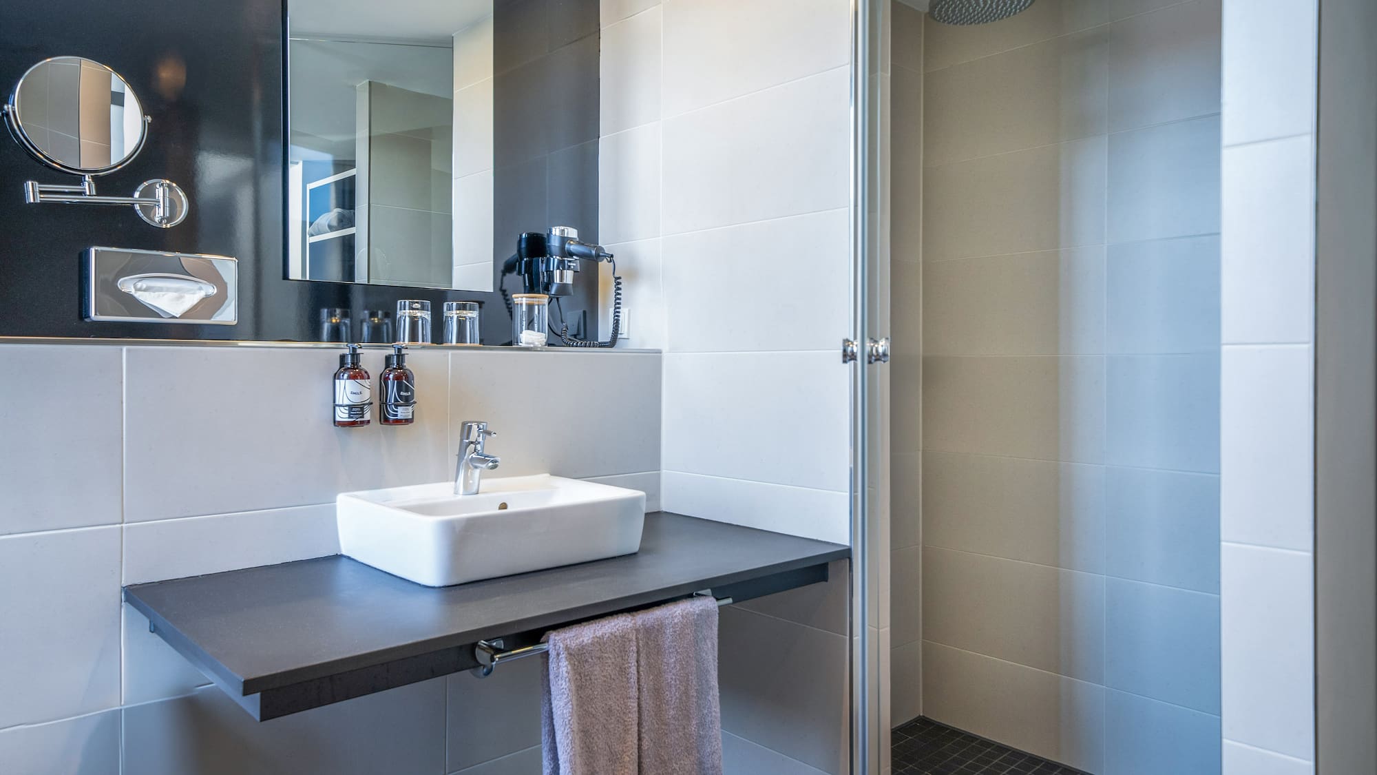 a bathroom with a sink and shower