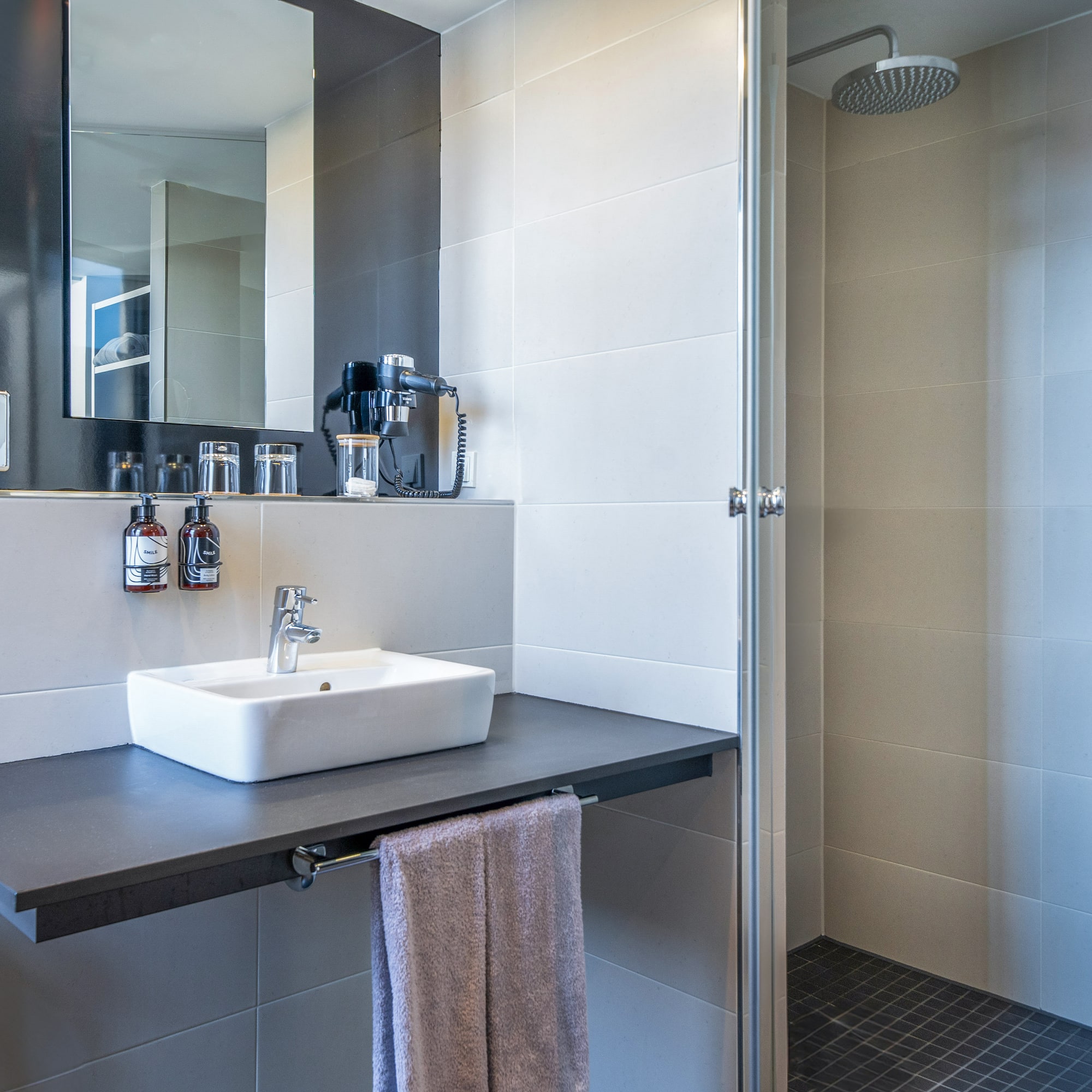 a bathroom with a sink and shower