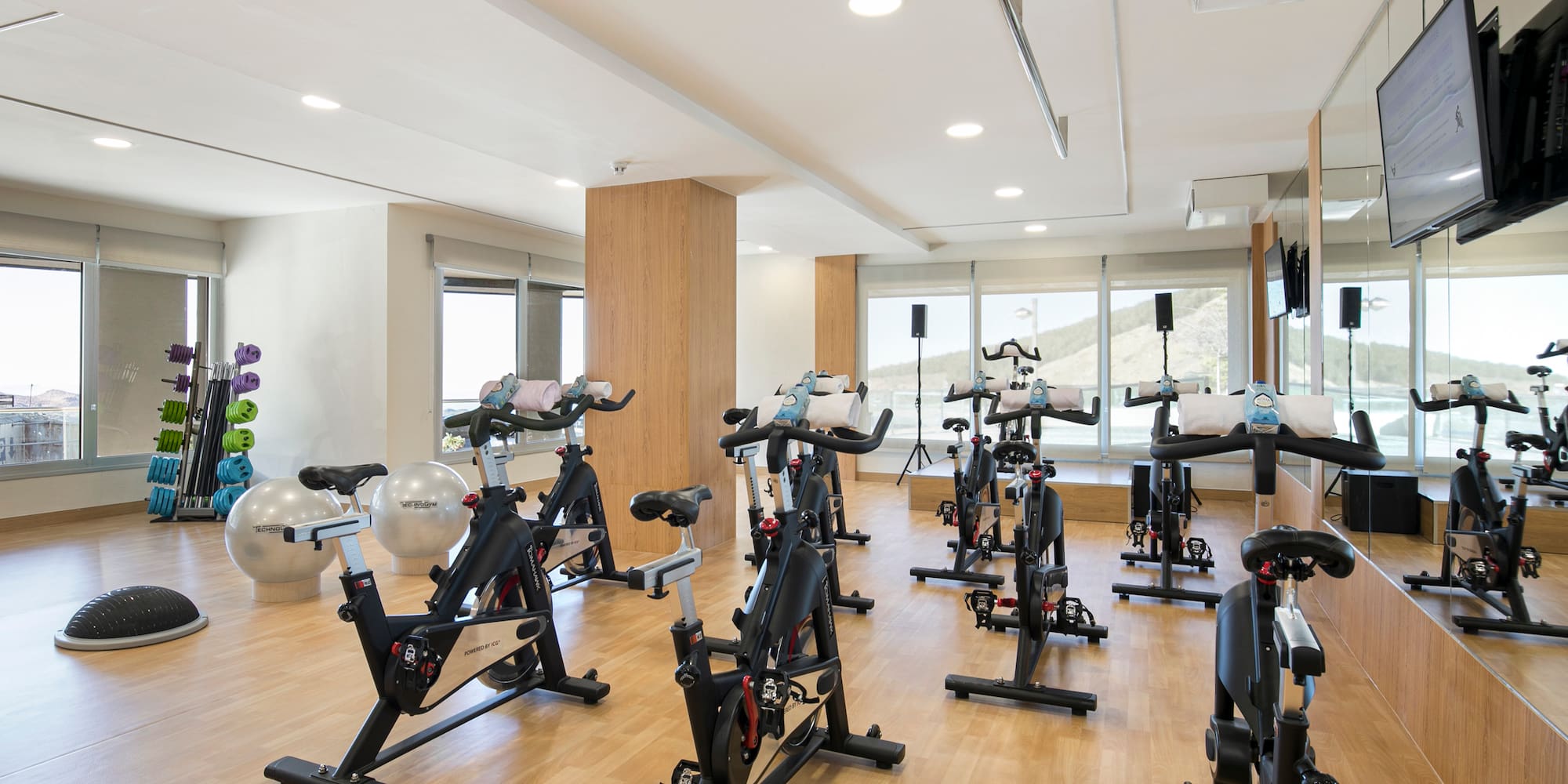 a room with exercise bikes and exercise equipment
