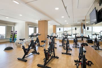 a room with exercise bikes and exercise equipment