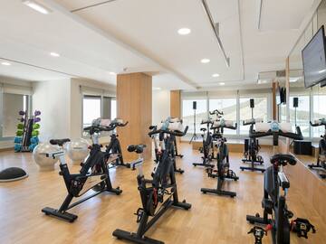 a room with exercise bikes and exercise equipment