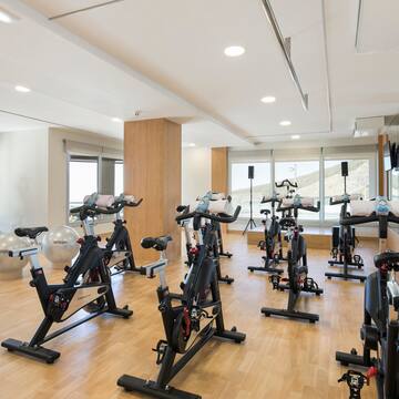 a room with exercise bikes and exercise equipment