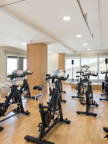a room with exercise bikes and exercise equipment