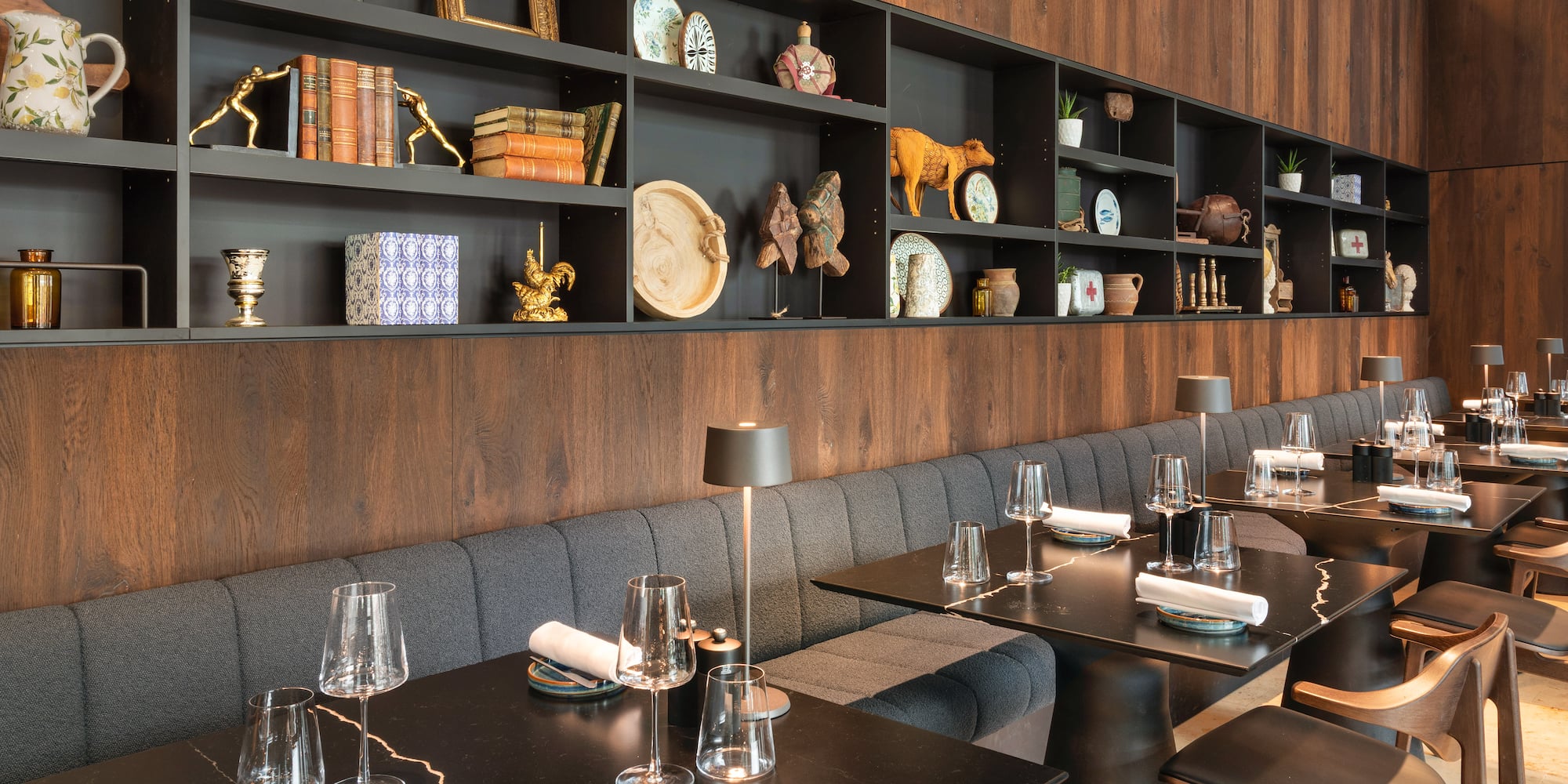 a restaurant with a booth seating and table set