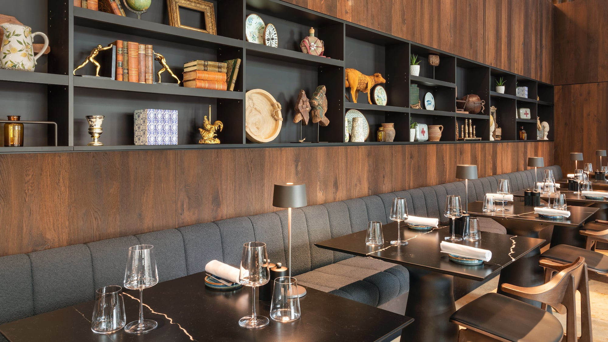 a restaurant with a booth seating and table set