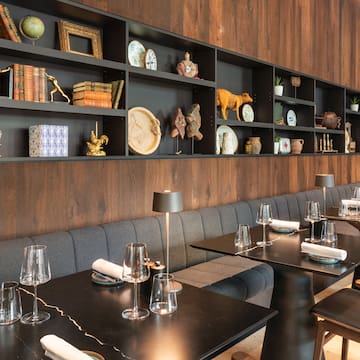 a restaurant with a booth seating and table set
