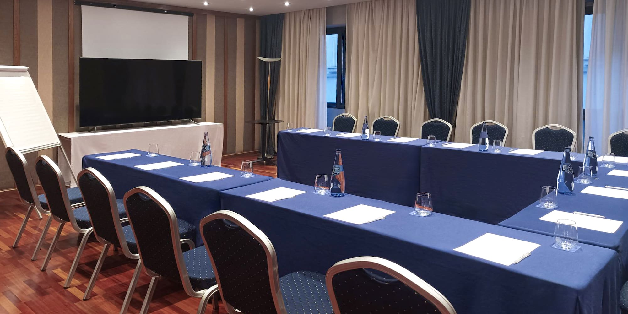 a room with a large table and chairs