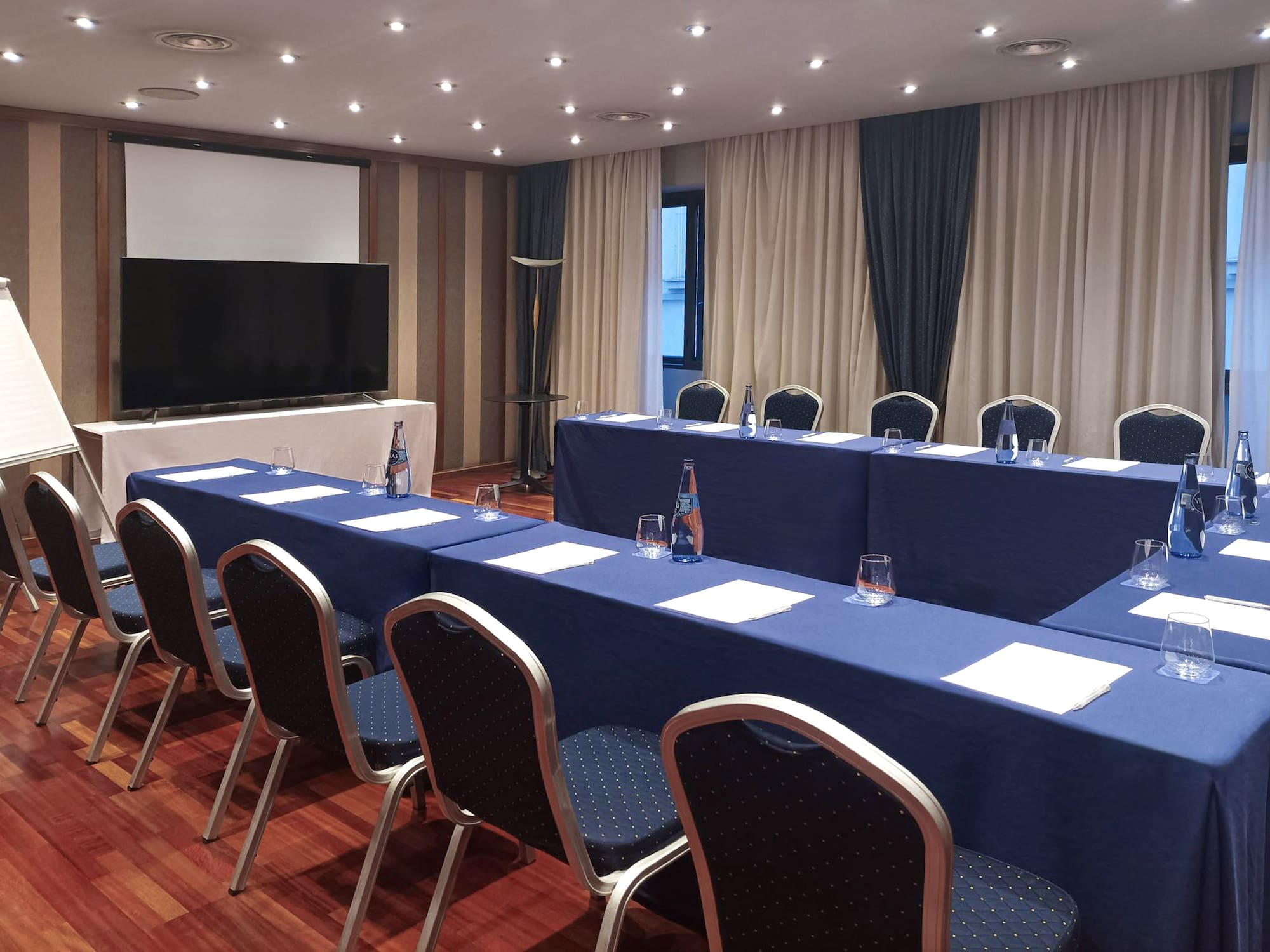 a room with a large table and chairs