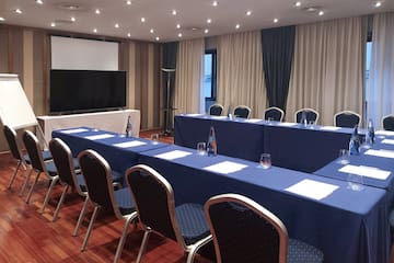 a room with a large table and chairs