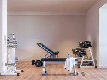 a room with weights and a bench
