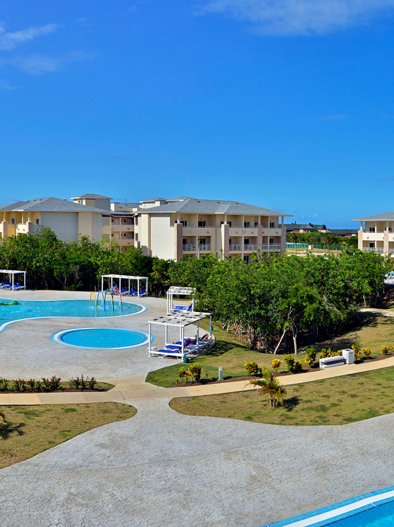 a pool with buildings and trees