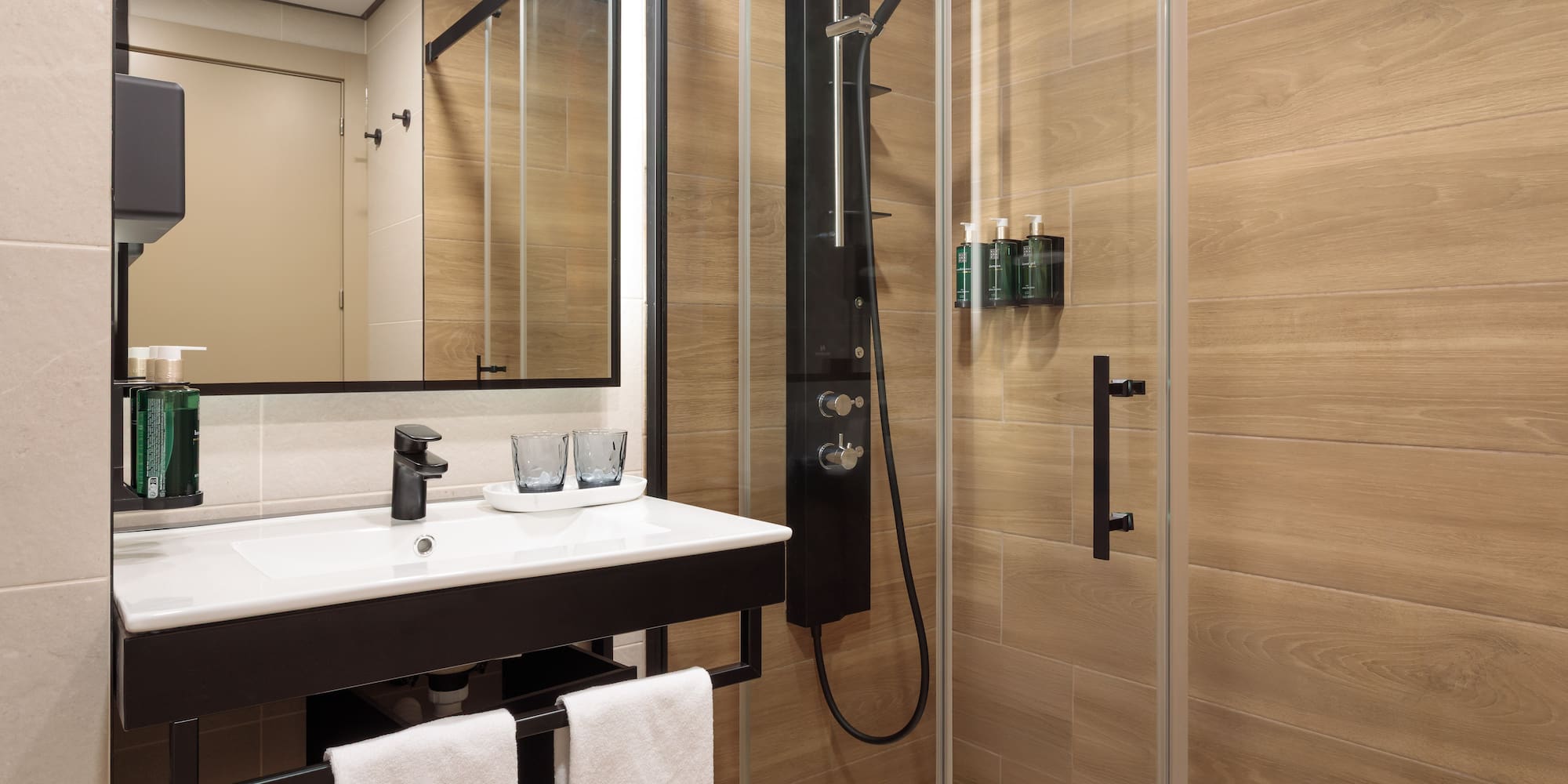 a bathroom with a shower and sink