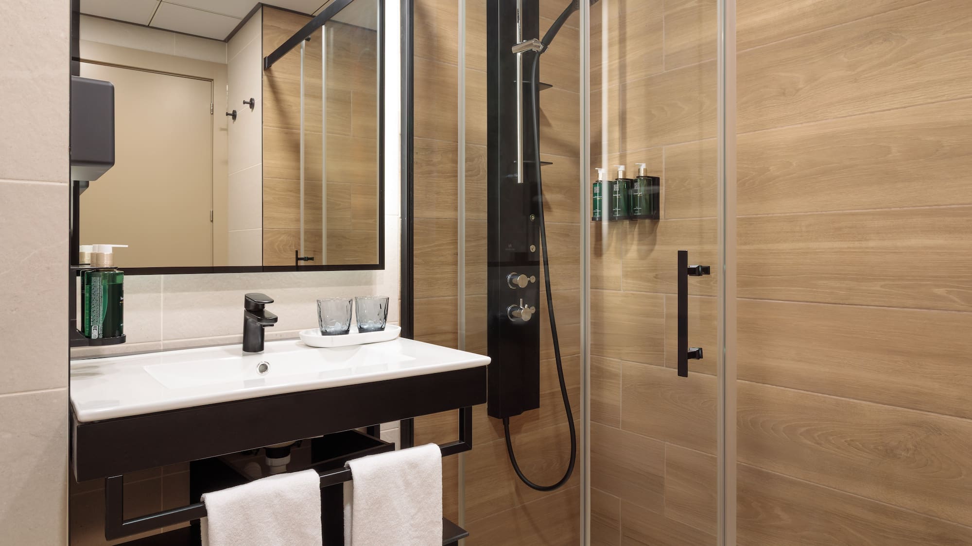 a bathroom with a shower and sink