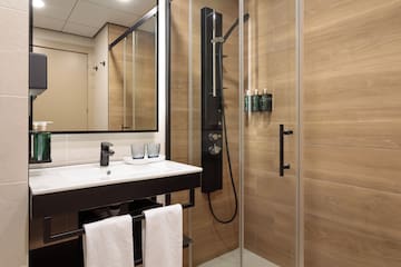 a bathroom with a shower and sink